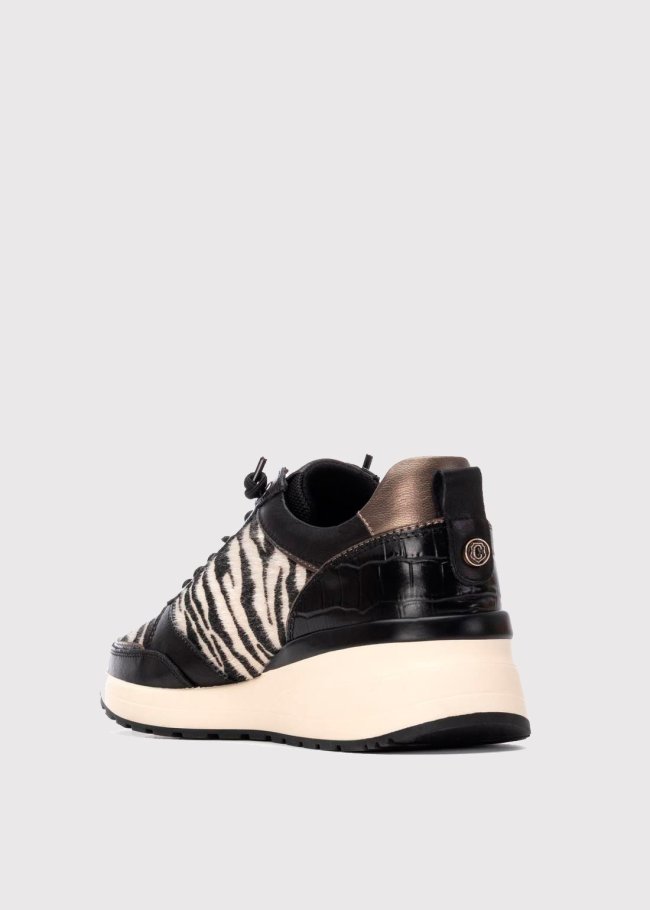 deportiva piel negro animal print